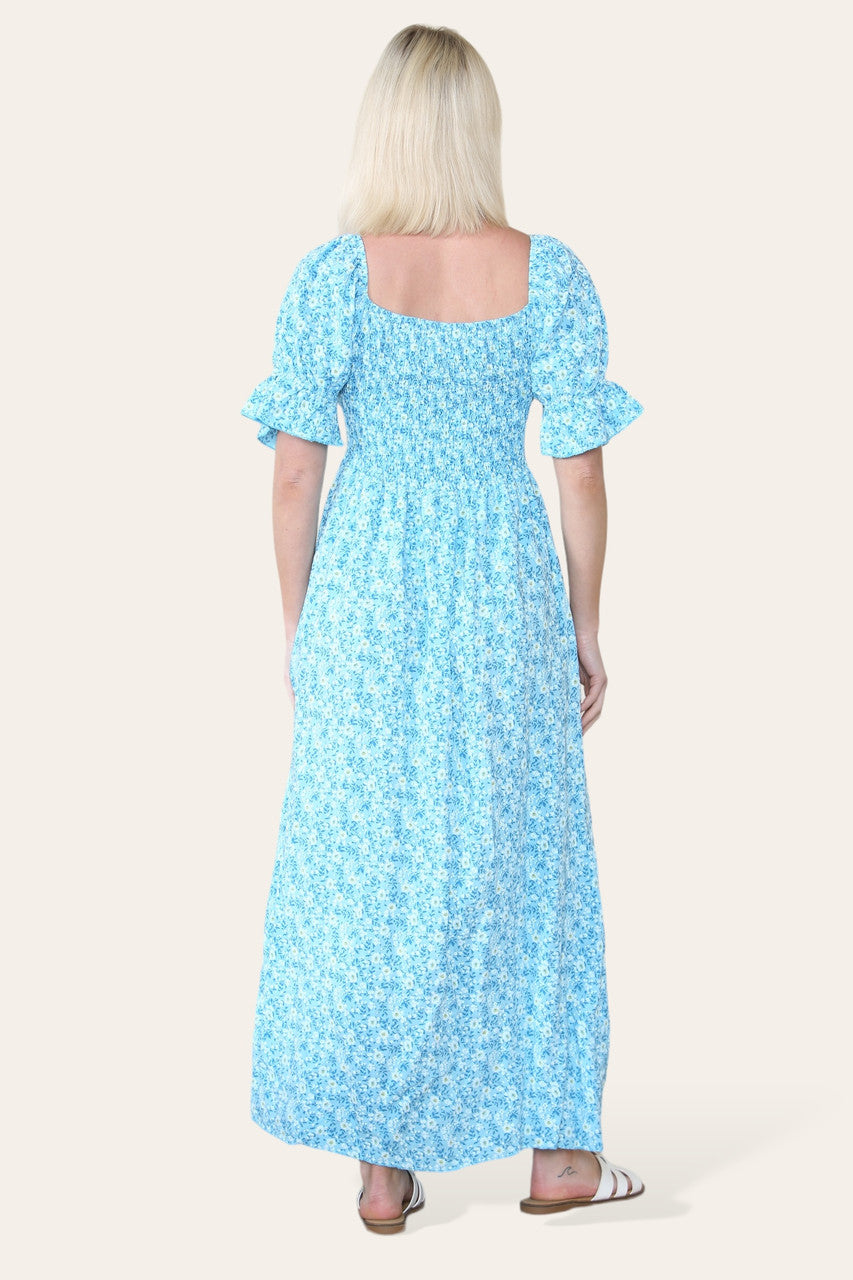 MAXIJURK MET BLOEMENDESSIN EN BARDOT-HALS TURQUOISE