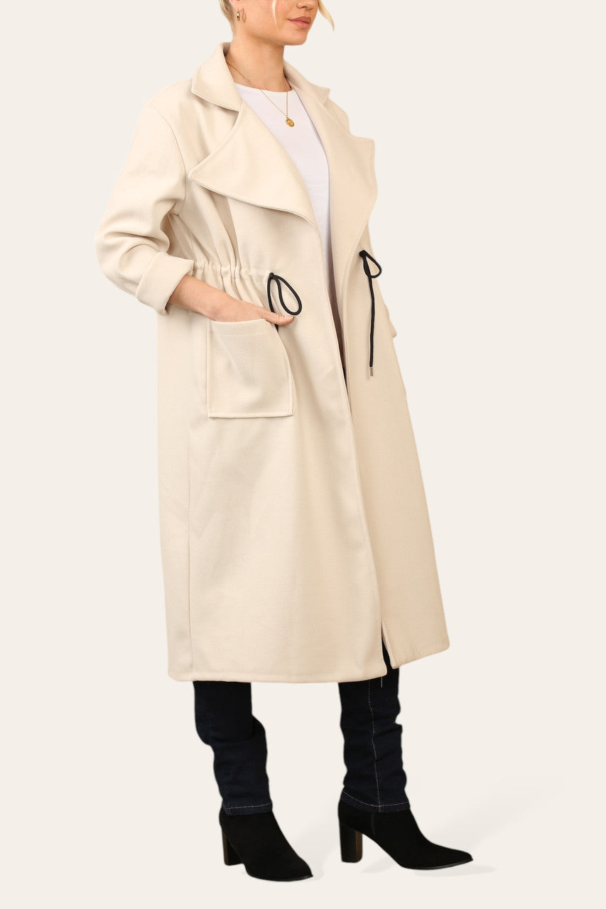 OVERSIZED JAS MET TREKKOORD IN DE TAILLE BEIGE