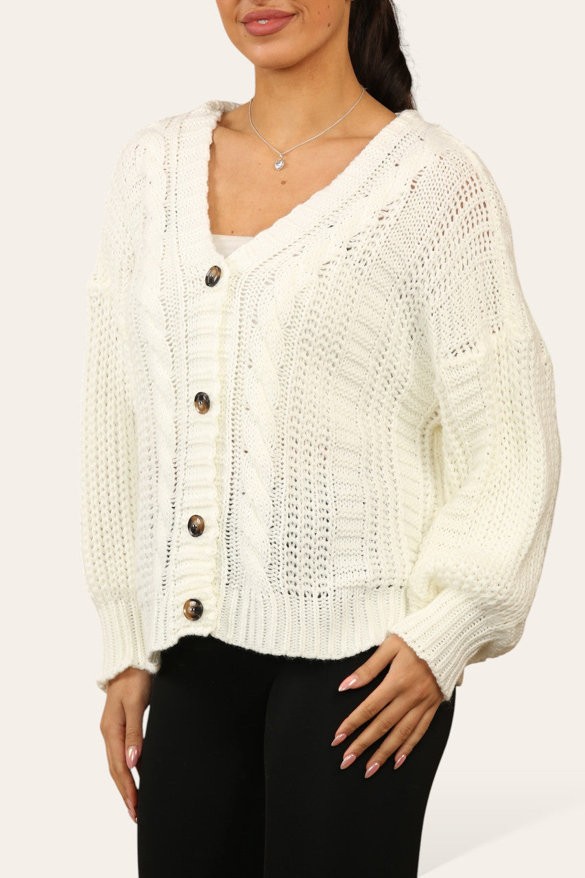 KABELGEBREIDE CARDIGAN MET KNOPEN CRÈME