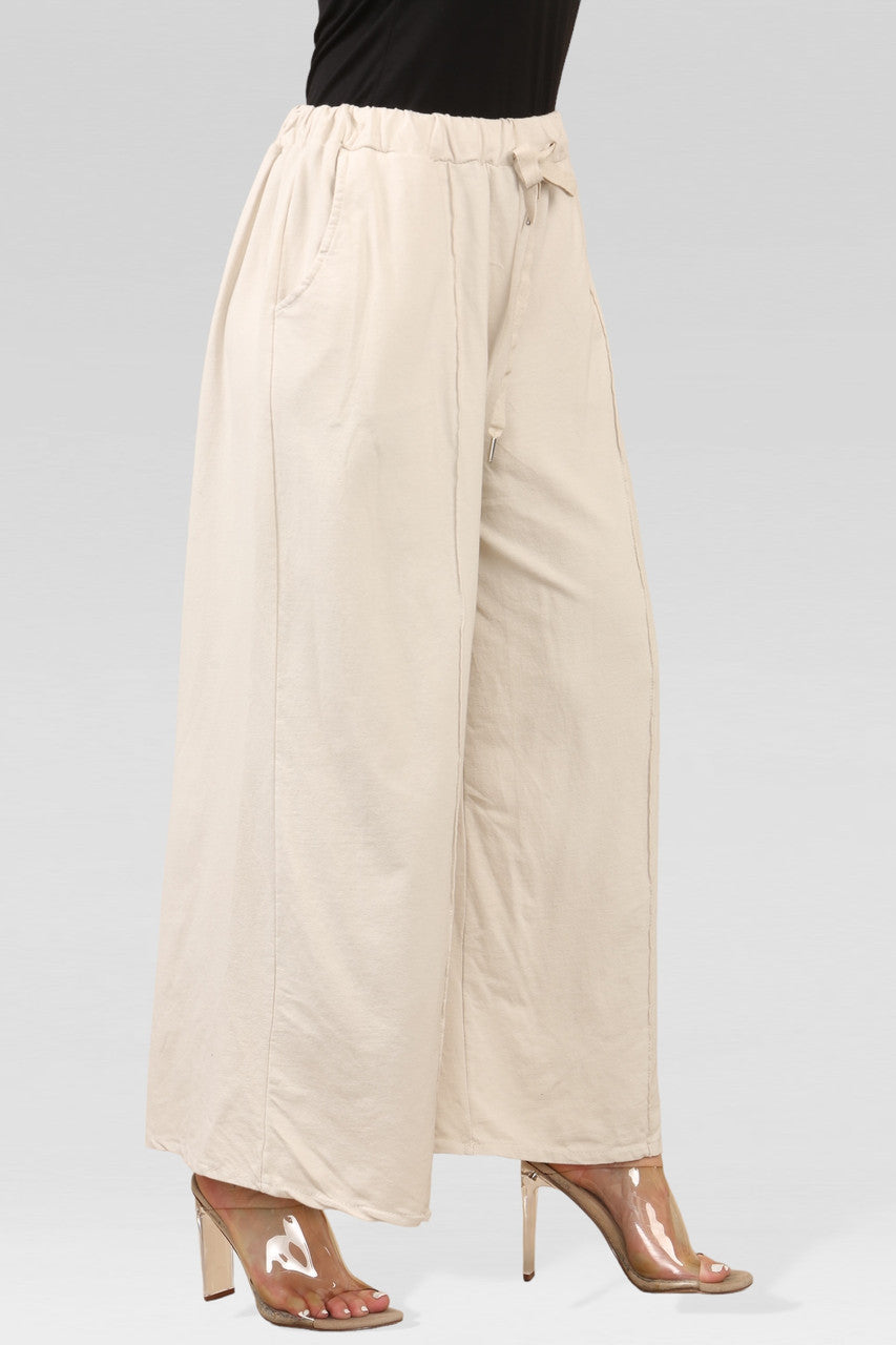 JOGGINGBROEK MET WIJDE PIJPEN STEENKLEUR