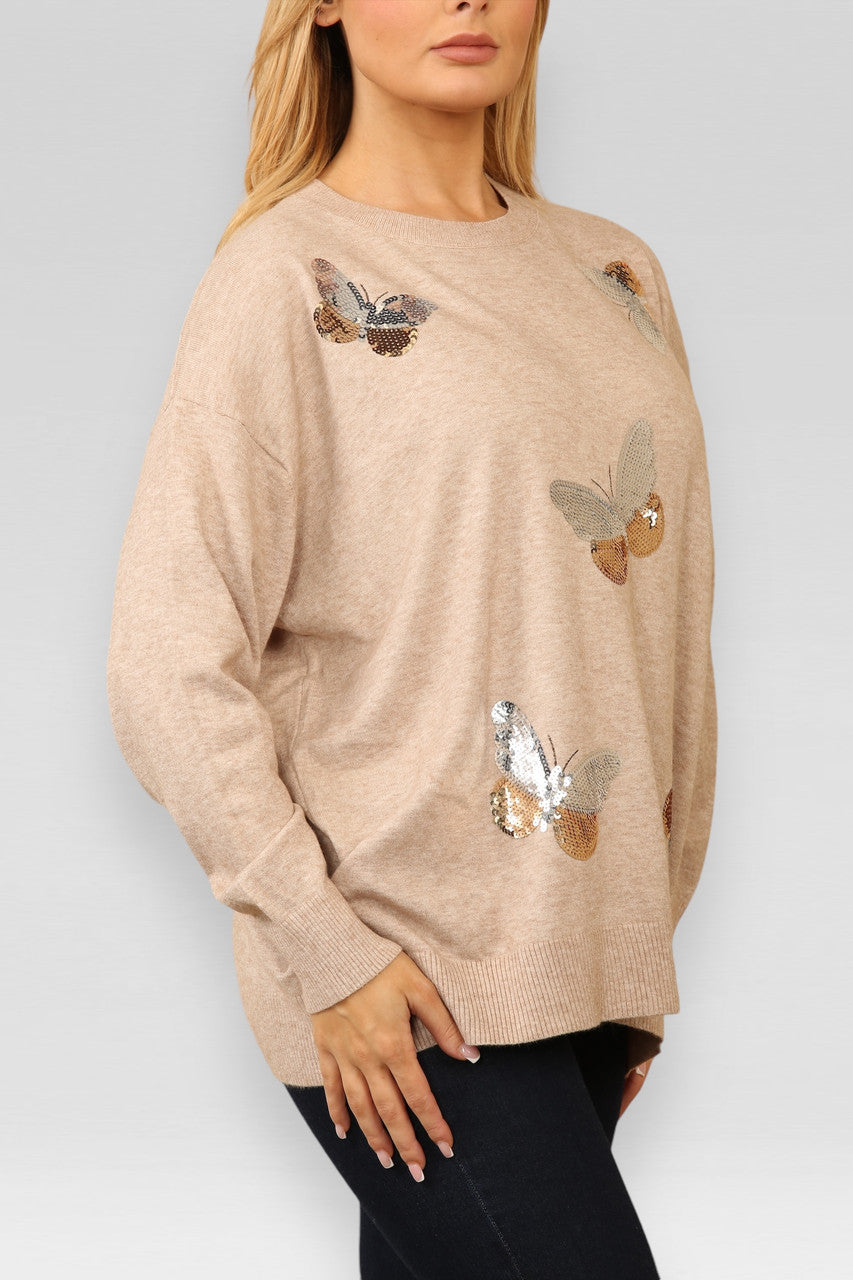 GEBREIDE TRUI MET PAILLETTEN VLINDER BEIGE