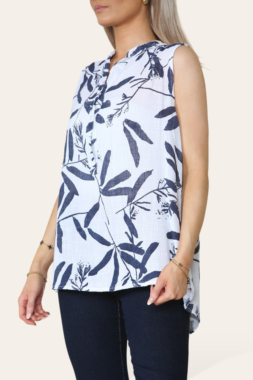 BLOUSE ZONDER MOUWEN MET GRANDAD-KRAAG EN BLADSCHADUWPRINT WIT