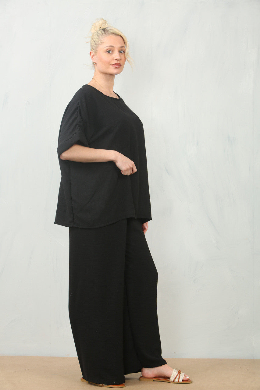 LUCHTERSIGE BLOEMEN CORSAGE TOP & BROEK SET - ZWART