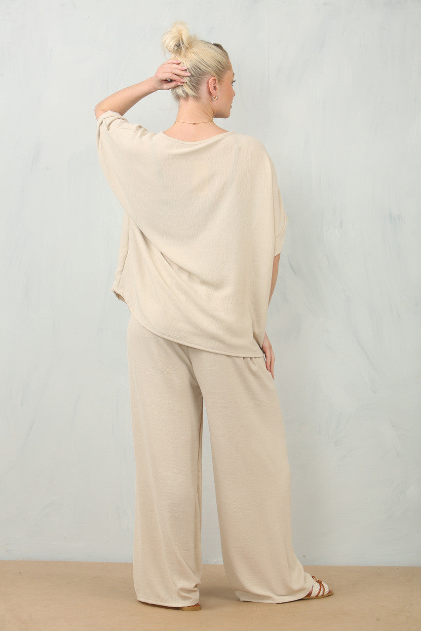 ZWEVENDE BLOEMENCORSAGE TOP & BROEK SET - STEEN