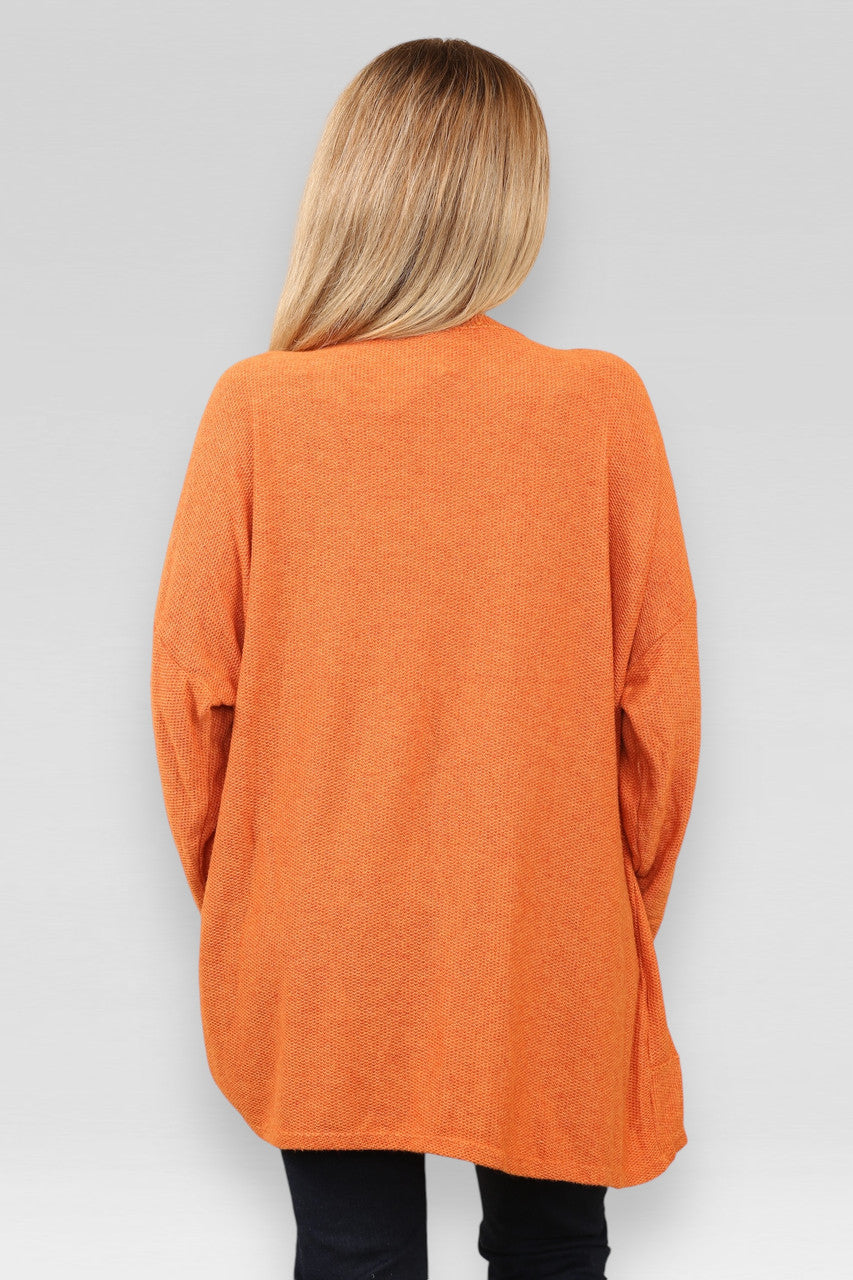 TRUI MET UITGEBRANDE KANTEN SCHOUDERDETAILS ORANJE