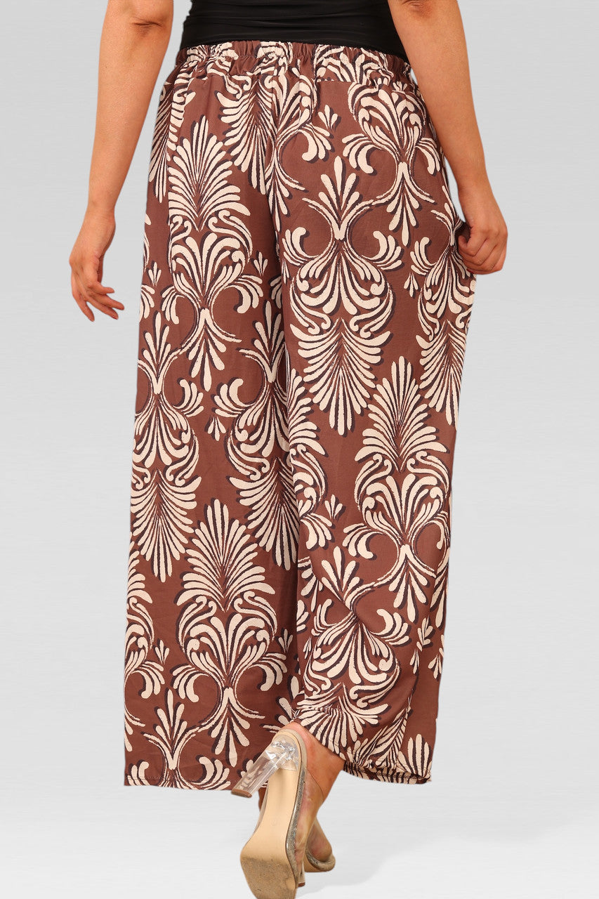 WIJDE PIJP BROEK MET ELASTISCHE TAILLE EN ART DECO PRINT ROEST