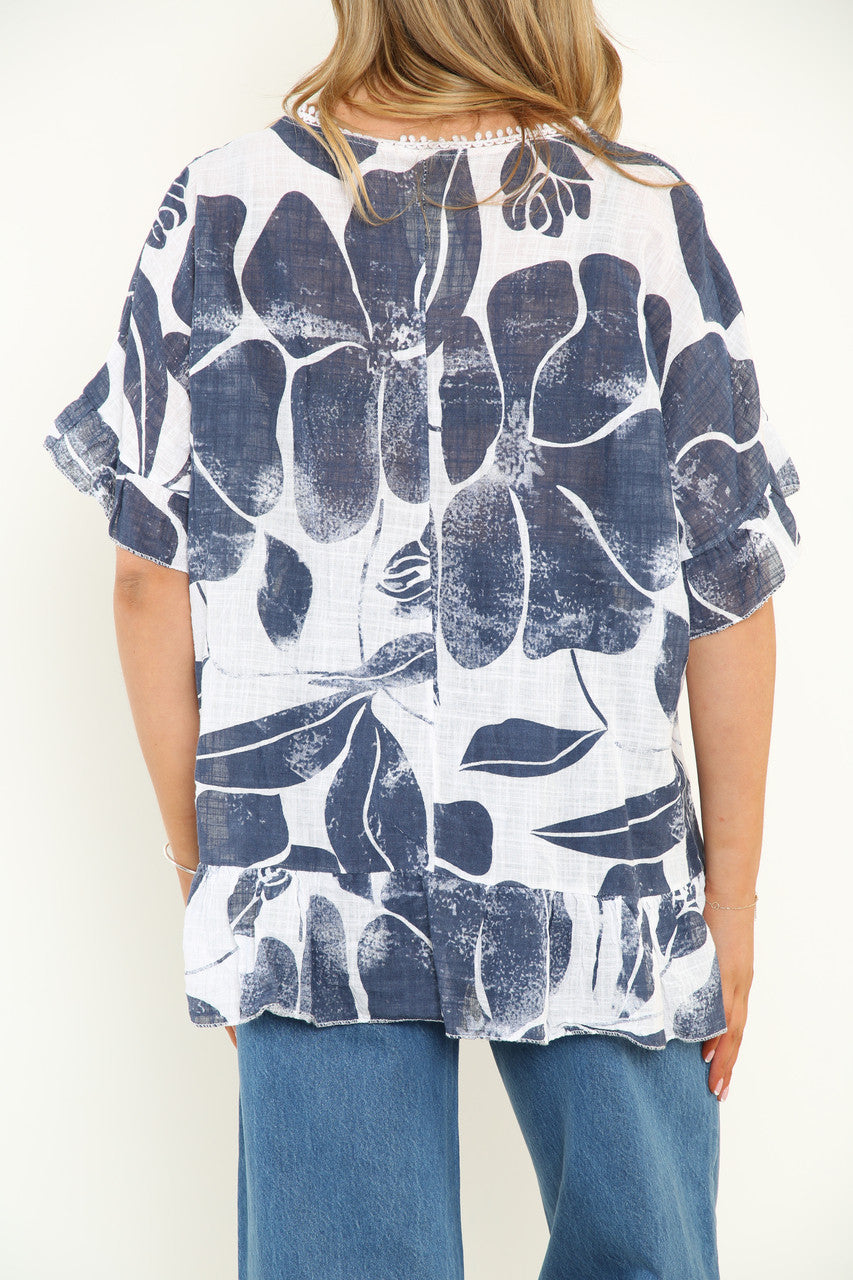 Witte top voor dames met bloemenprint en ruches