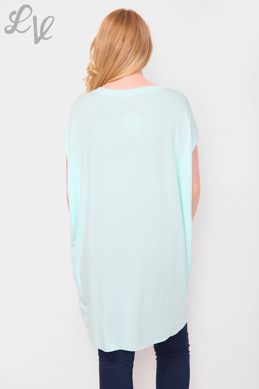 Dames effen tuniektop lichtblauw per stuk € 5,99