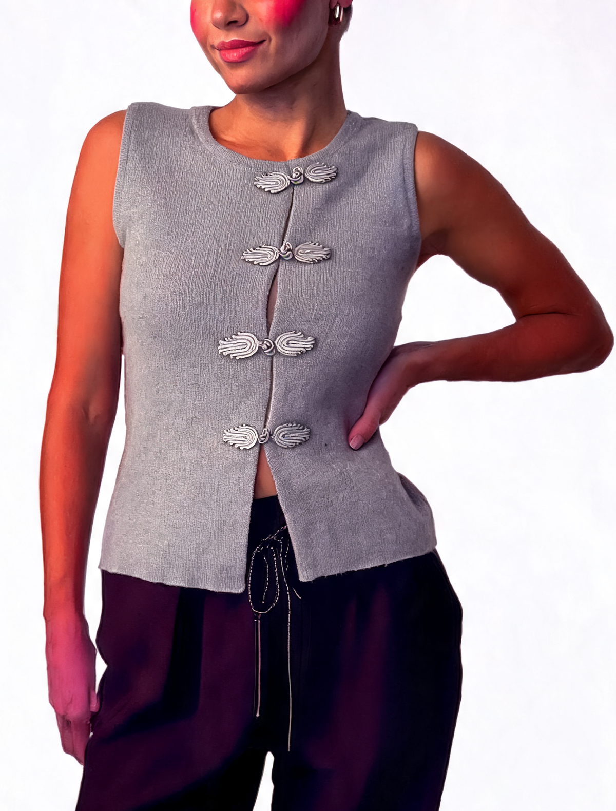 Grey textured knit sleeveless wrap waistcoat with frog fasteners, asymmetric hem