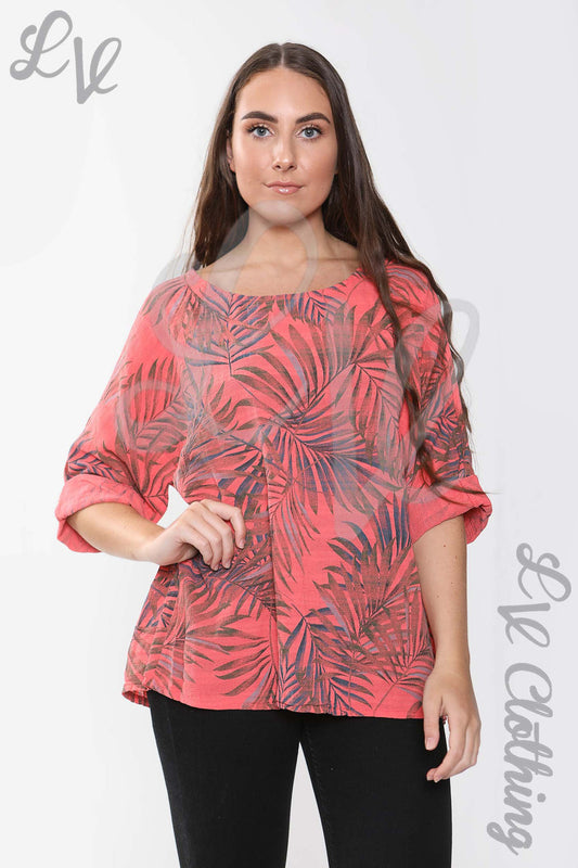 Women’s coral palm-leaf print top with 3/4 puff sleeves and round neckline