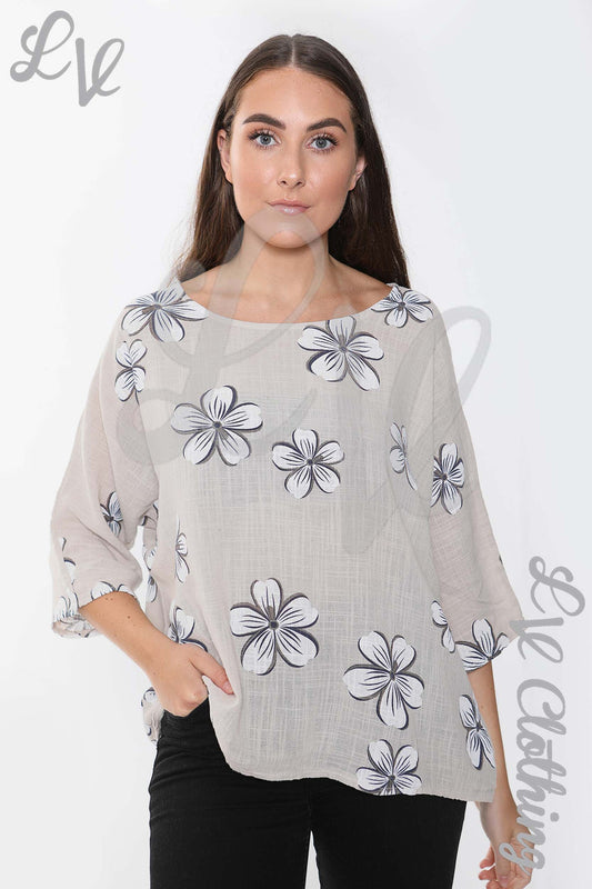 Stone ladies daisy print top with 3/4 sleeves and round neckline, loose fit