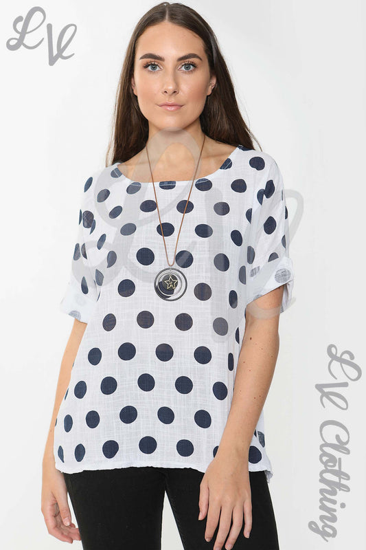 Ladies spotty print top with short sleeves, white base and navy dot pattern