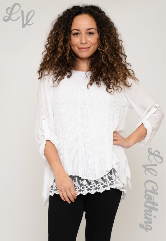 White loose-knit crochet blouse with round neck, lace hem, and sheer elbow sleeves