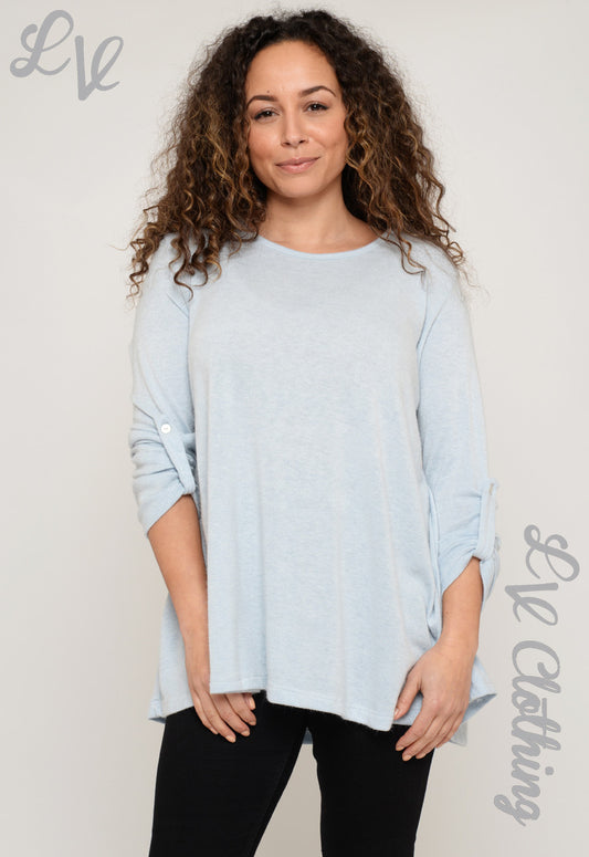 Light blue plain women's long-sleeve top with curved hem and side split