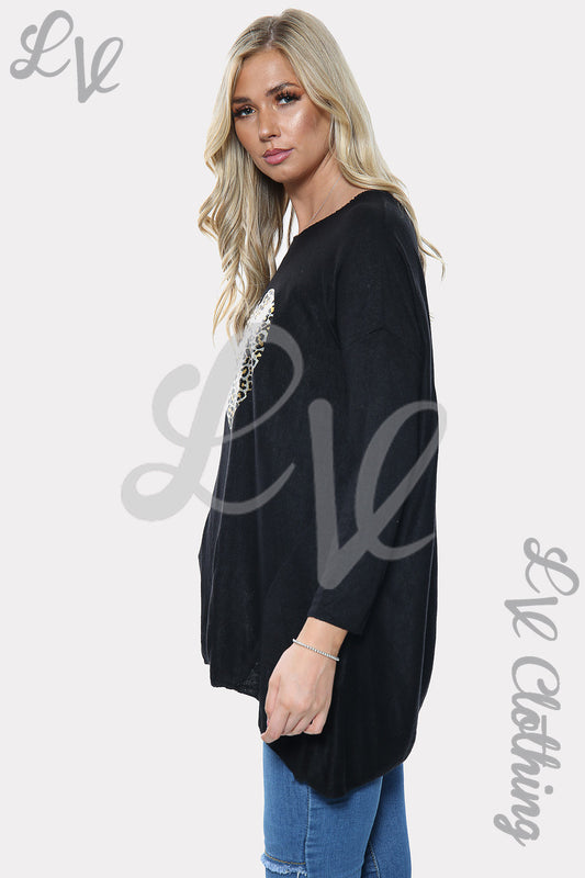 Black ladies sweatshirt with long sleeves, crew neck, side view.