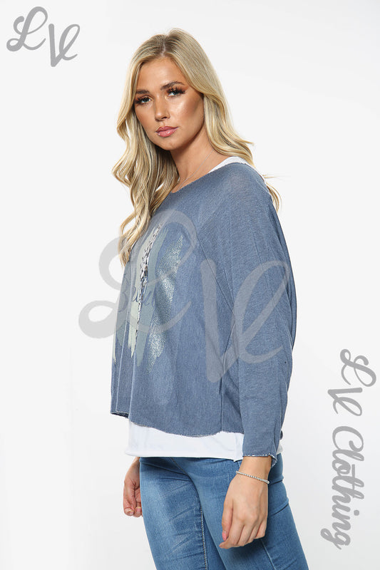 Two-layer slogan top with blue long-sleeve denim-look outer and white hem