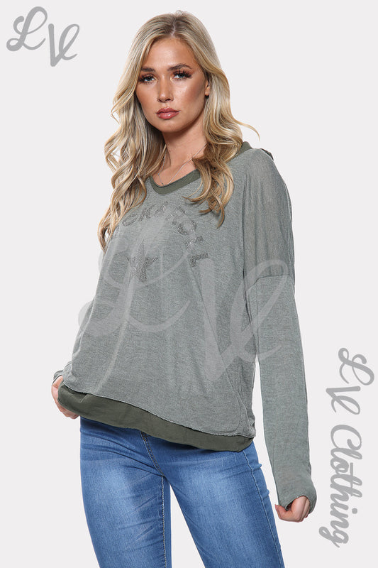 Grey two-layer star print top with long sleeves and rounded neckline