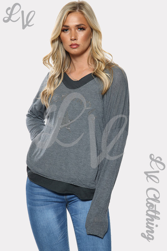 Grey two-layer long-sleeve top with star graphic print and black underlayer hem