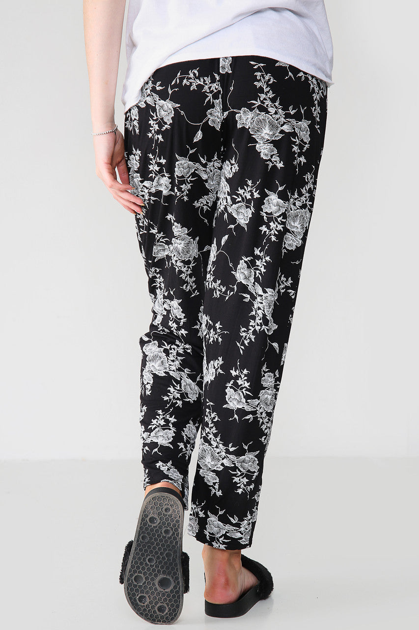 ELASTISCHE BROEK MET BLOEMENPRINT ZWART