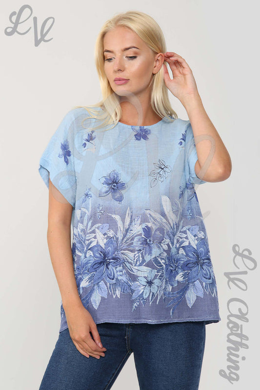 Light blue floral print short-sleeve top with curved hem and round neckline