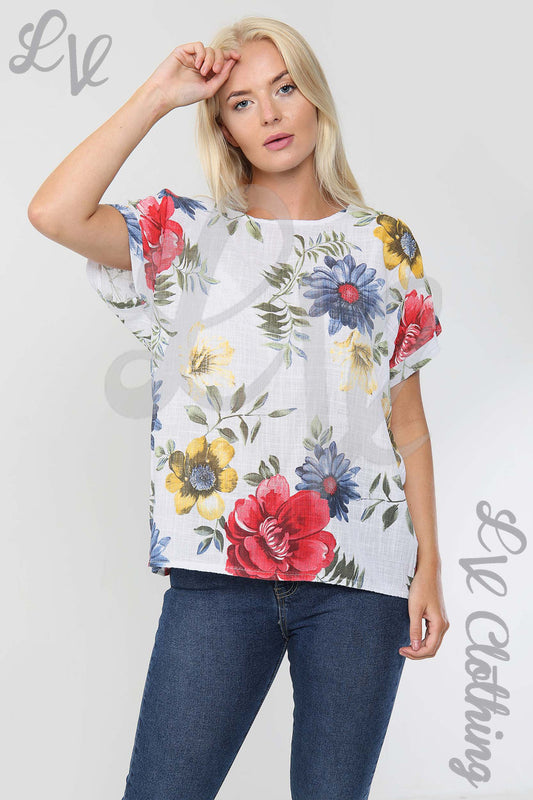 Floral short-sleeve top, crew neck; white with red, blue, yellow flowers