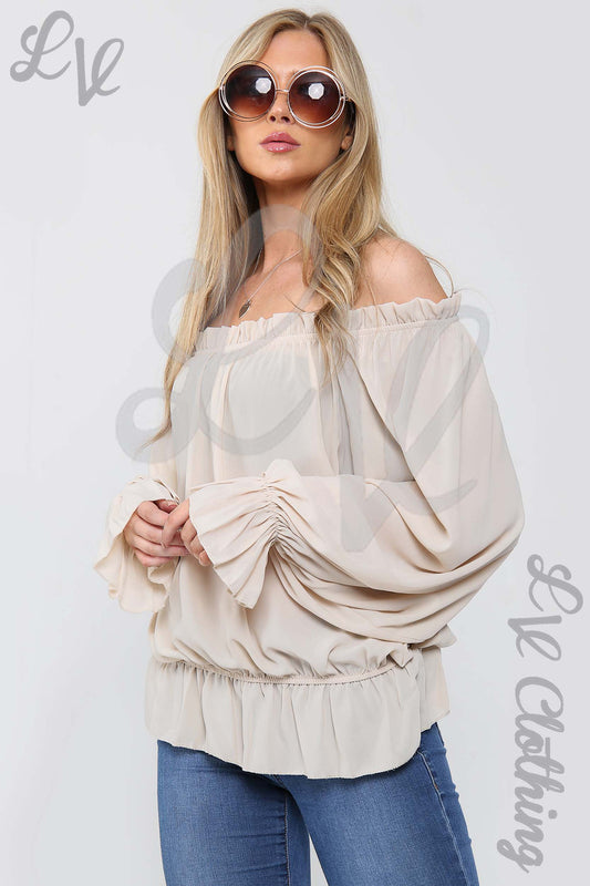 Cream off-shoulder frill hem blouse with long puff sleeves and elastic neckline
