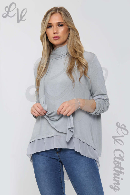 Women's silver long-sleeve top with draped scarf and layered hem