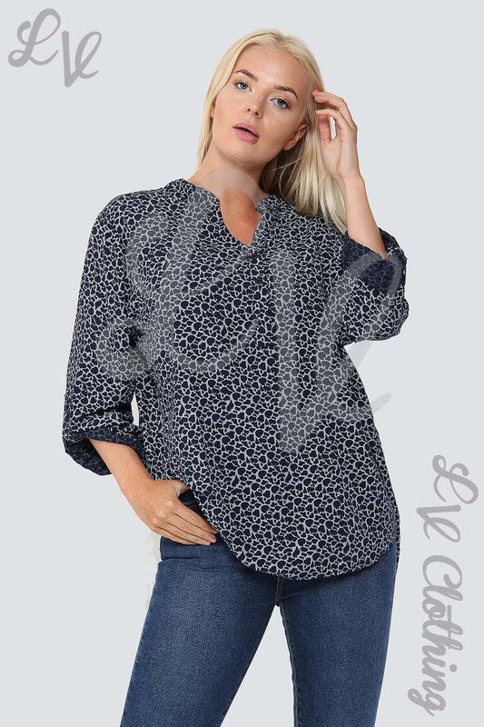 Navy giraffe print grandad-style blouse with V-neck and three-quarter sleeves