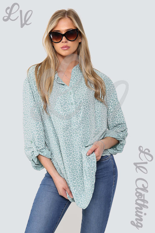 Tiffany blue giraffe-print grandad blouse with V-neck collar and 3/4 sleeves