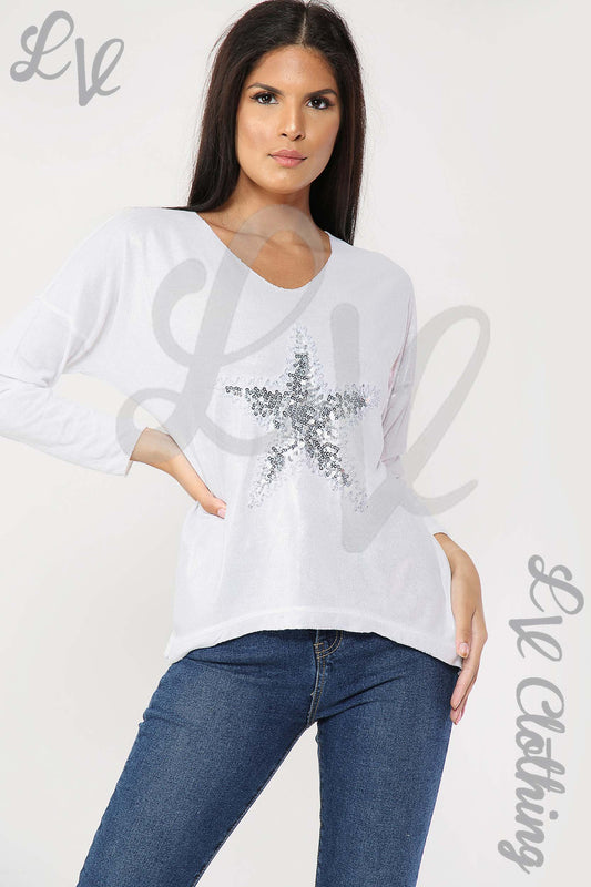 Women’s white long-sleeve top with glitter star front detail and V-neck