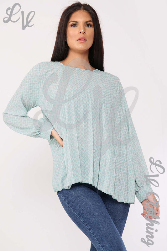 Light blue pleated blouse with circle print, long sleeves, round neckline, loose fit