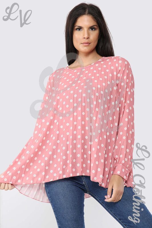 Salmon pink polka dot pleated blouse with long sleeves and wide cuffs