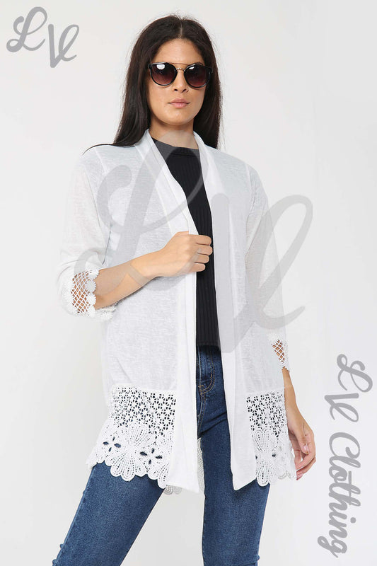 White lace-trim cardigan with floral border, open front, long sleeves