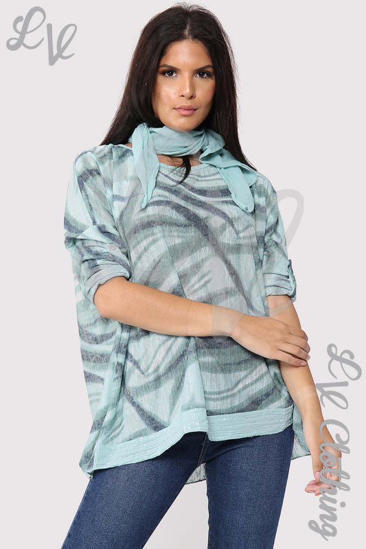 Swirl print tunic top with turquoise cowl neck scarf and long sleeves