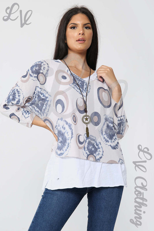 Dusty pink tie-dye print V-neck blouse with long sleeves and tassel necklace