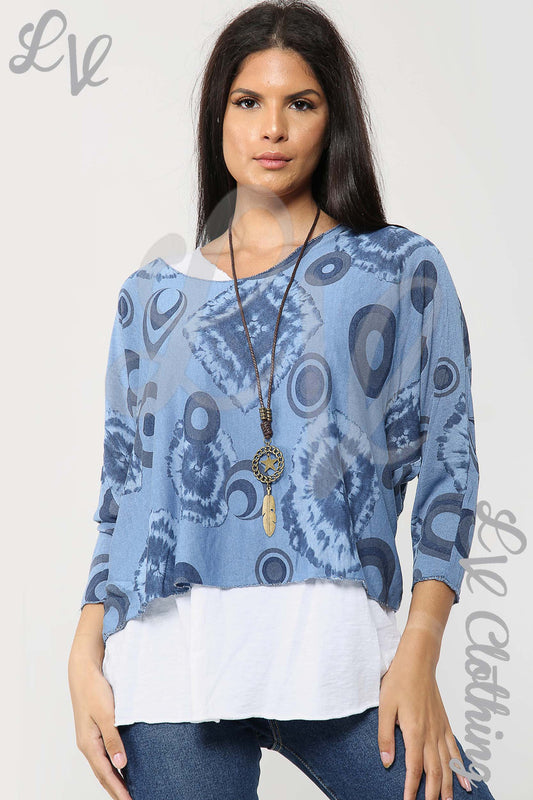 Two-piece blue tie-dye top with white hem layer and pendant necklace