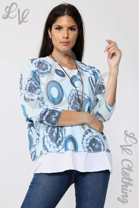 Light blue tie-dye print blouse with wide sleeves and layered hem