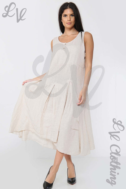 Ladies sleeveless cream dress with scoop neck and pleated hem detail