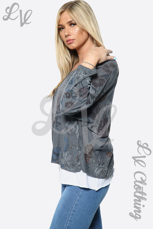 Two-layer floral print top in dark charcoal with long sleeves and layered white hem