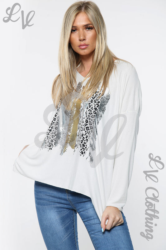 White ladies jumper with leopard foil paint print at chest and long sleeves