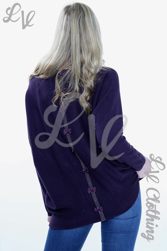 Purple jumper with diamante bow and stone trim on the back neckline