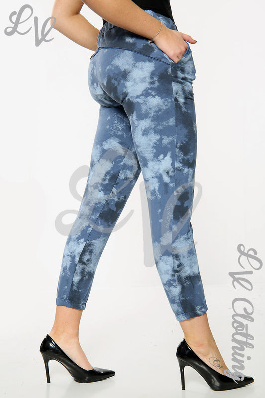 Sky-print denim-style jogger pants, blue and white clouds, cuffed ankle