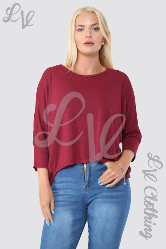 Burgundy fine knit hi-lo hem top with 3/4 sleeves and crew neck