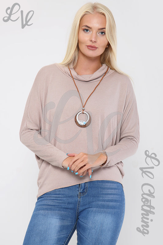 Dusty pink cowl neck top with long sleeves and round pendant necklace