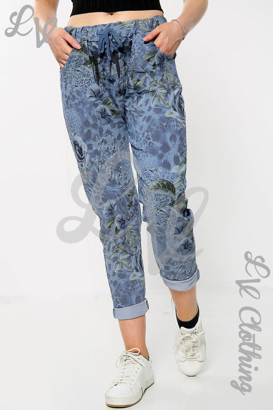 Floral print crinkle jogger pants in blue with elastic waistband and cuffed hem
