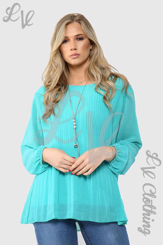 Ladies pleated long-sleeve turquoise blouse with pendant necklace