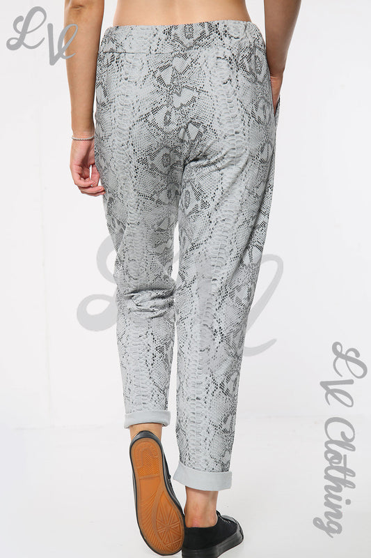 Snake print jogger pants, silver-gray with tapered cuffs and elastic waistband