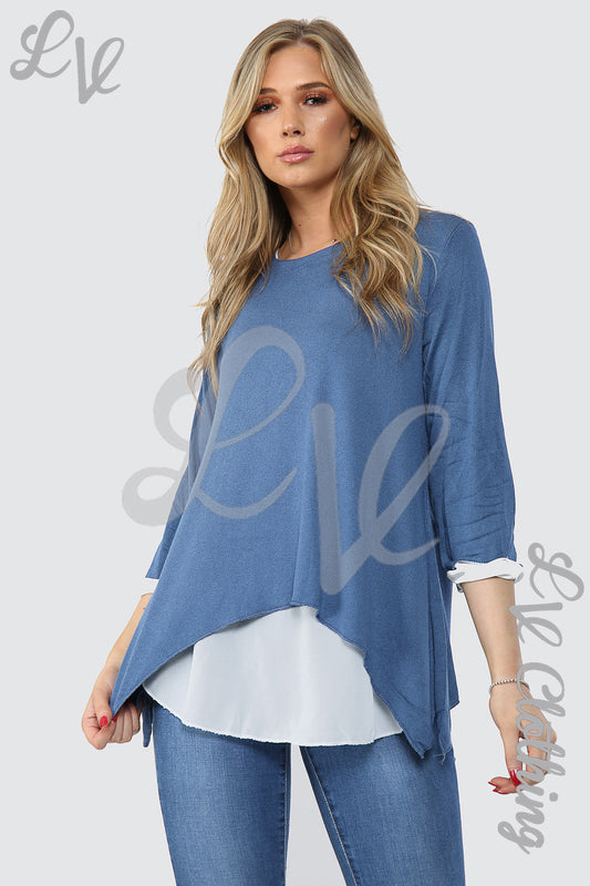 Blue double-layer shirt top, long sleeves with white cuffs and draped asymmetric hem