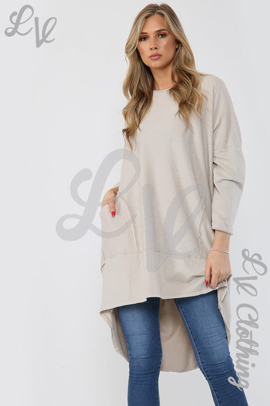 Beige ribbed tunic with zip hem detail and long sleeves, tunic length