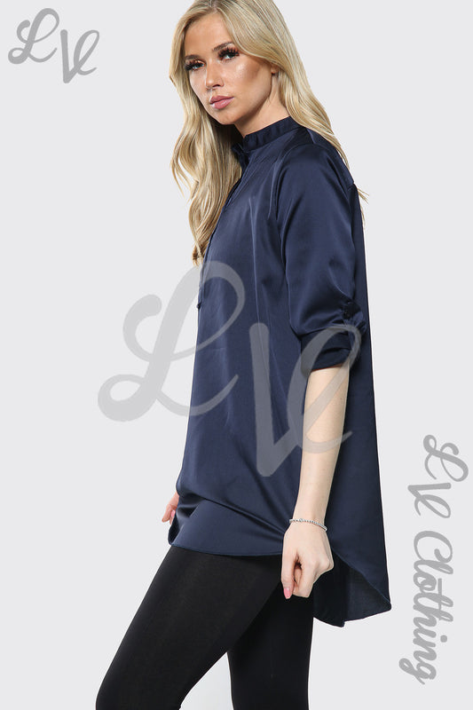 Navy satin shirt dress with collar, long sleeves, and curved hem